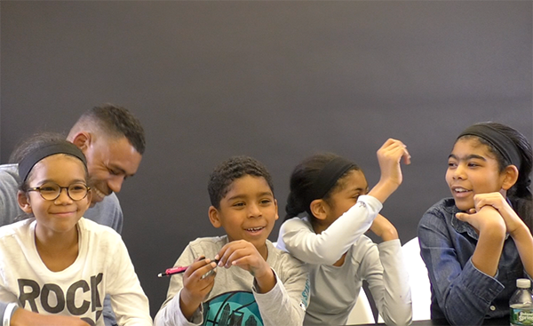 Allan Houston with Children at FISLL Office